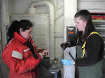 Emily and Robyn getting mud samples from the multi corer.